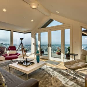 A bright, freshly cleaned San Francisco living room with soft winter light coming through large windows and a calm, modern feel.