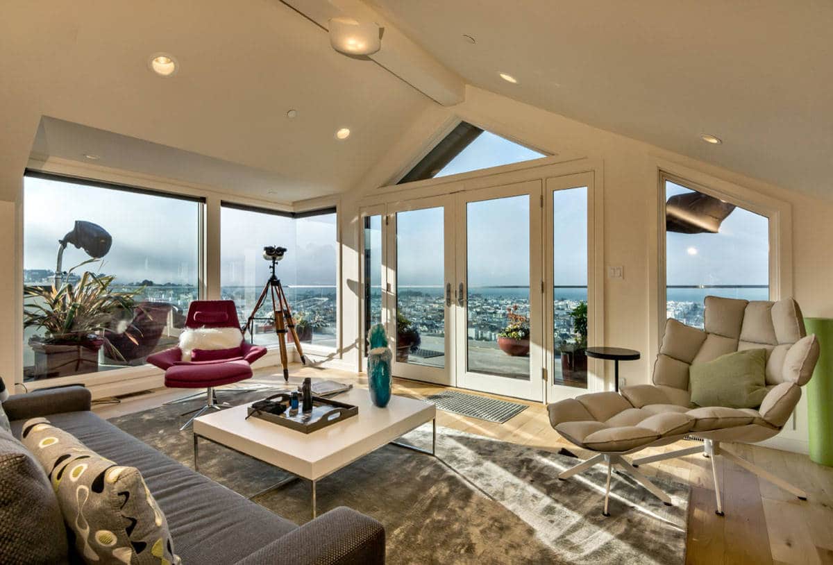 A bright, freshly cleaned San Francisco living room with soft winter light coming through large windows and a calm, modern feel.